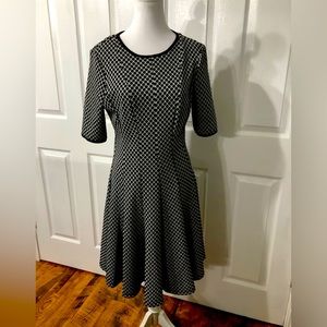 Women’s size 10 black and white danny and nicole flare skirt dress.